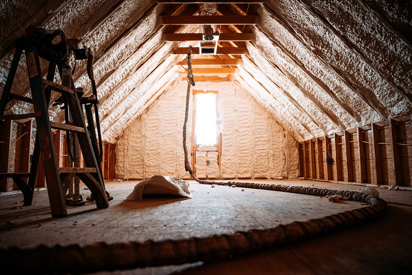 inside view of an attic covered with spray foam